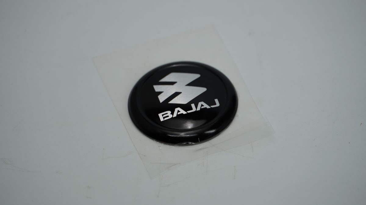 Наклейка логотип крышки генератора JF233218 BAJAJ